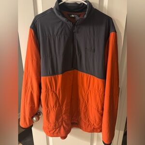 Excellent condition North Face 1/4 zip. Burnt orange and dark grey